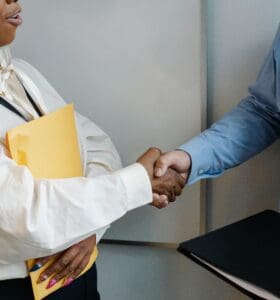 a man and woman shaking hands